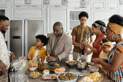 African American family making environmentally friendly food in their kitchen