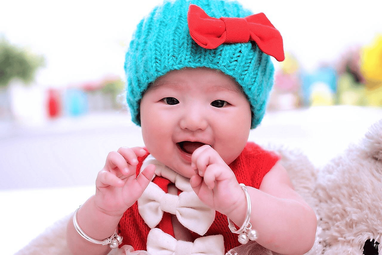 Baby with colorful hat and clothes