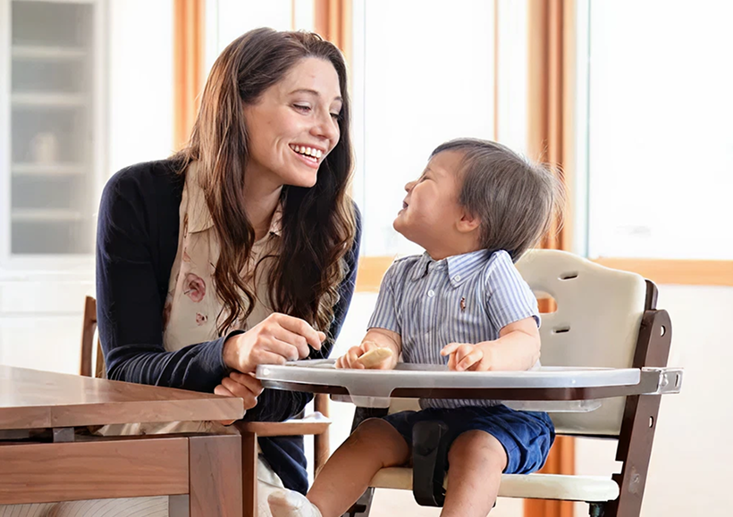 Mom with child doing high chair activities